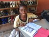 Haiti: lernendes Straßenkind